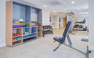 a fitness room with a gym with tread machines at Hilton Garden Inn São José do Rio Preto in Sao Jose do Rio Preto