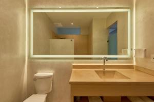 a bathroom with a sink and a mirror at Casa Quiote Hotel Boutique City Center based - Adults Only in Oaxaca City