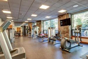 a gym with treadmills and exercise equipment in a building at Hyatt Main Street Station 3BD B - Steps to Peak 9 in Breckenridge