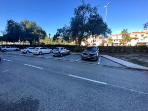 a group of cars parked on the side of a road at Marina de la duquesa 602 in Castillo de Sabinillas