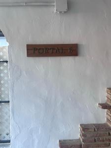 a sign that reads portal on a white wall at Marina de la duquesa 602 in Castillo de Sabinillas