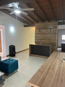 a living room with a table and a tv at Excellent House (Laureles) Jacuzzi and 6 Rooms in Medellín