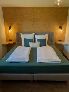 Säng eller sängar i ett rum på Bergromantik Apartments Fritzenlehen