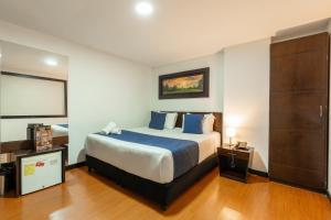 Postel nebo postele na pokoji v ubytování Hotel Bogota Resort