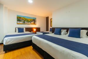 Postel nebo postele na pokoji v ubytování Hotel Bogota Resort