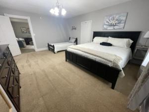 a large bedroom with a large bed and a desk at Anoka Apartments in Historical Victorian House in Anoka