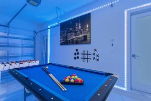 a billiard room with a pool table and balls at Lux Backyard/Heated Pool/Everglades/Speedway/Keys! in Miami