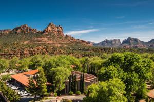 a view of a church with mountains in the background at Arroyo Roble Resort at Oak Creek in Sedona