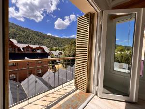a balcony with a view of a mountain at Aloha pinot Patagonia in San Martín de los Andes
