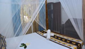 Postel nebo postele na pokoji v ubytování Golden Lodge Tangalle
