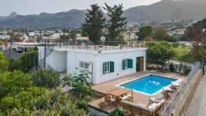 a house with a swimming pool on top of it at Sotiris House in Kazaphani