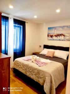 Posteľ alebo postele v izbe v ubytovaní Apartman Roso