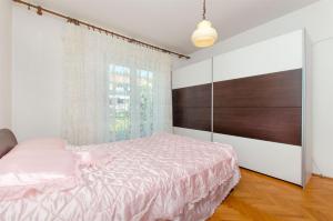 Postel nebo postele na pokoji v ubytování Apartments Bozjidar