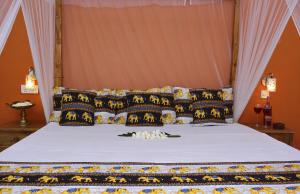 Postel nebo postele na pokoji v ubytování Golden Lodge Tangalle