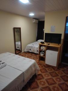 Cama ou camas em um quarto em Pousada Klein