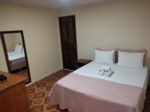 Cama ou camas em um quarto em Pousada Klein