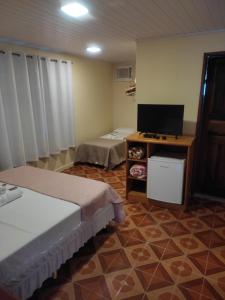 Cama ou camas em um quarto em Pousada Klein