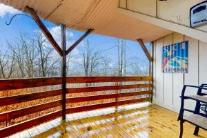 a screened in porch with a table and chairs at Timber Ridge C7 in Sugar Mountain