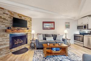 a living room with a couch and a fireplace at Timber Ridge C7 in Sugar Mountain