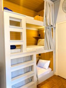 Postel nebo postele na pokoji v ubytování Lamparina Hostel