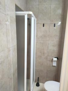 a bathroom with a shower with a toilet and a sink at Casa Playa de la Mata in La Mata
