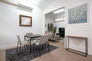a dining room with a table and chairs at CitySide Pad in Tamworth