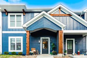 a house with blue siding at Parking! Hot tub! 10 min walk to beach in Michigan City