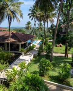 an aerial view of a resort with palm trees at Tabula Rasa Resort & Spa in Galle