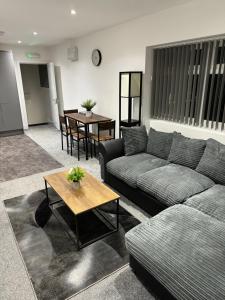 a living room with a couch and a table at Coatham house in Redcar