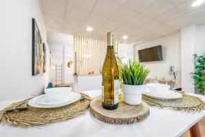 a bottle of wine sitting on top of a table at Sintra Nest - Near the train to Lisbon and Sintra (3 min) in Sintra