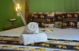 Postel nebo postele na pokoji v ubytování Golden Lodge Tangalle