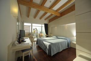 Rúm í herbergi á Park Hotel Il Vigneto