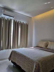 En eller flere senge i et værelse på Casa Nova com Suíte!