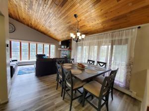 a dining room with a table and chairs at Ocean & Mountain View Duplex, both sides in Juneau