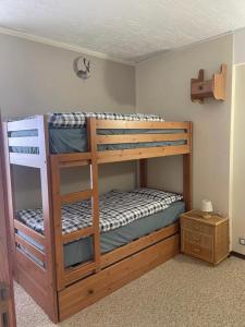 a bunk bed room with two bunk beds at CASA VACANZA NIDO COLLETTO in Case Arfel