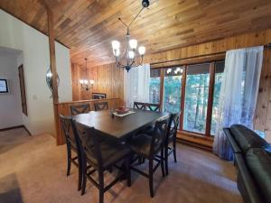 a dining room with a table and some chairs at Updated Duplex with Mountain & Filtered Water View in Juneau