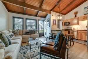 a living room with a couch and a table at Chic Greek Peak Ski Resort Townhome with Balconies in Cortland