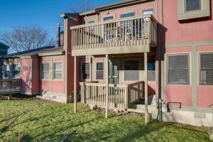 een roze huis met een terras aan de zijkant bij Chic Greek Peak Ski Resort Townhome with Balconies in Cortland