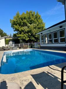 a swimming pool in front of a house at Mountainview Cottage in Chilliwack