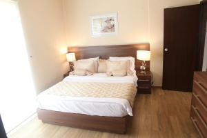 Postel nebo postele na pokoji v ubytování Dreams Suites