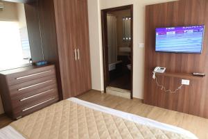 TV a/nebo společenská místnost v ubytování Dreams Suites