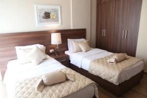 Postel nebo postele na pokoji v ubytování Dreams Suites