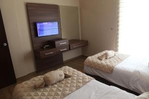 Postel nebo postele na pokoji v ubytování Dreams Suites
