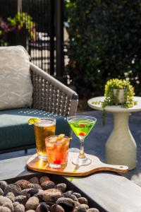 a tray with two drinks on a table at Ayres Hotel Huntington Beach/Fountain Valley in Fountain Valley