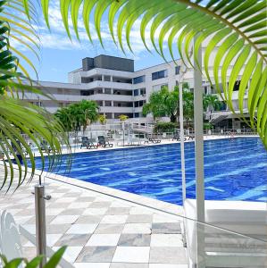 a view of a swimming pool in a building at Hotel del Llano in Villavicencio