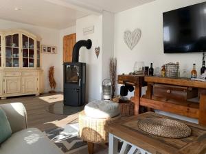 TV/trung tâm giải trí tại Ferienhaus Norddeichkieker -Nähe Büsum