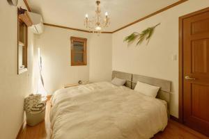 Postel nebo postele na pokoji v ubytování 1棟貸切BBQ可 本格ダーツ かき氷機 Villa上条