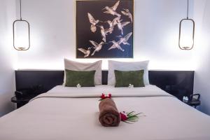 Postel nebo postele na pokoji v ubytování Uluwatu Yoga Resort