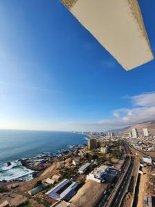 an aerial view of a city and the ocean at Playa Huayquique, primera linea in Iquique