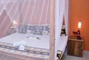 Postel nebo postele na pokoji v ubytování Golden Lodge Tangalle